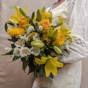 Delight arrangement with vibrant, cheerful flowers in a compact, joyful display