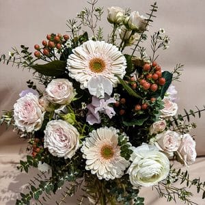 Bliss floral arrangement featuring a lush mix of seasonal blooms in soft pastel tones