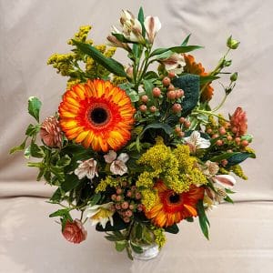 Candor arrangement with bold flowers arranged to express honesty and openness